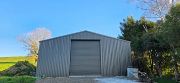 Front view of truck shed with roller door
