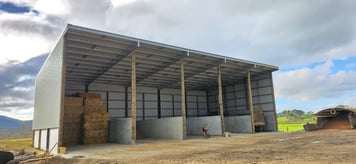 Full exterior view of open sided hay shed